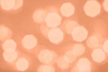 Peach Fuzz lights bokeh background, Chrismas lights bokeh. Monochrome abstract background. Blurred...