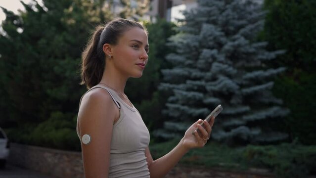 Beautiful diabetic woman preparing for outdoor workout in the city.