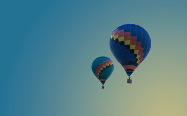 Hot air balloons flying at blue sky background - romantic landscape with two colorful balloons....