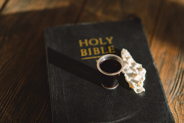 Communion. Religious tradition of breaking bread. Bread and wine as a sign of memory of Christ's sacrifice.