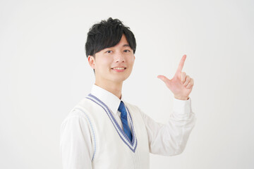 チェックサインをする男子高校生　白背景