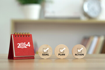 Happy New Year 2024 banner background. 2024 numbers year with target dart icon on red small desk calendar with Goal, Plan, Action on wooden cube. Business goals plan action and success concepts. - obrazy, fototapety, plakaty