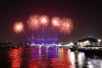 Light and firework show over the old steel bridge ,Phra Phuttha Yodfa Bridge at Bangkok, Thailand Theme Vijit Chao Phraya 2023 Bangkok Thailand
