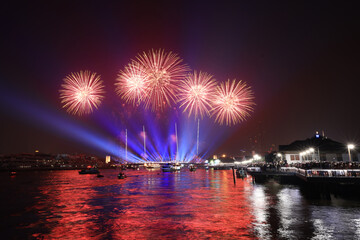 Light and firework show over the old steel bridge ,Phra Phuttha Yodfa Bridge at Bangkok, Thailand...