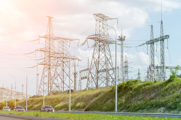 High voltage towers with sky background. Power line support with wires for electricity transmission. High voltage grid tower with wire cable at distribution station. Energy industry, energy saving