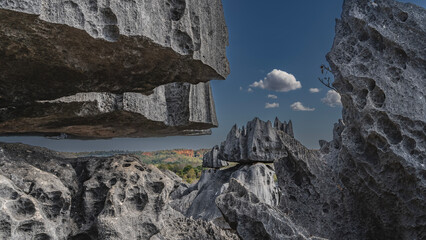 A unique natural formation is Tsingy De Bemaraha. Grey karst limestone cliffs with sharp peaks and...