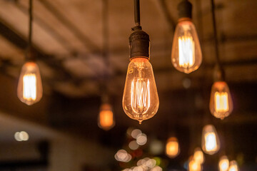 Group of Hanging Edison light bulb, also known as filament light bulb - obrazy, fototapety, plakaty