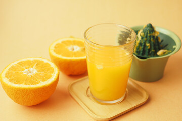 squeezing oranges into orange juice,