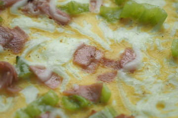Egg Omelette mixed with sausage closeup 
