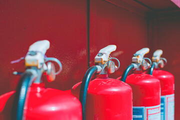 Red fire extinguishers available in fire emergencies