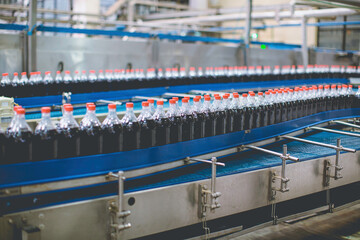 Beverage conveyor flowing with bottles