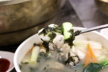 Korean food. oyster rice cake soup