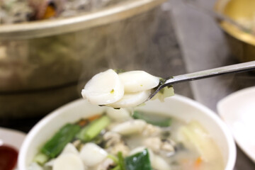 Korean food. oyster rice cake soup