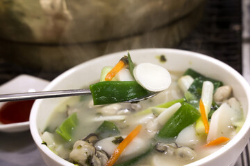 Korean food. oyster rice cake soup