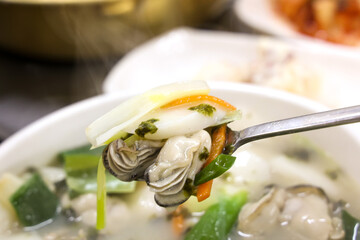 Korean food. oyster rice cake soup