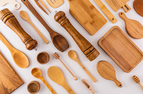 Kitchen wooden utensils, cooking tools on white background. Flat parallel diagonal layout. Kitchen beautiful background. cover. layout.