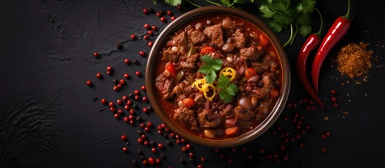 Fotobehang Top-down view of traditional Mexican culinary dish: chili con carne in a bowl. © 2rogan