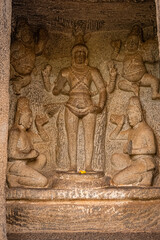 Fototapeta na wymiar Exclusive Monolithic Rock Carved - Thirumoorthi Cave Temple is UNESCO's World Heritage Site located at Mamallapuram or Mahabalipuram in Tamil Nadu, South India
