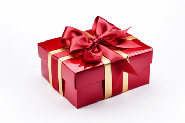 Obraz premium A red gift box wrapped with gold ribbon, isolated on a solid white background