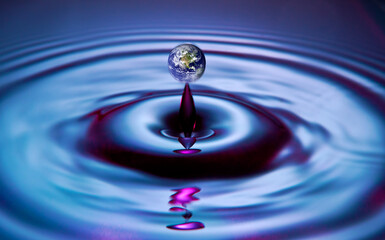 Naklejka na ściany i meble Earth globe floats on crystal clear water ripples. Earth Map courtesy of NASA