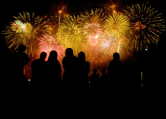 Fototapeta na wymiar People in Silouttee enjoy watching fireworks show