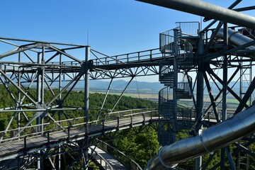 Naklejka premium Tourist attraction iron walkway high in the treetops
