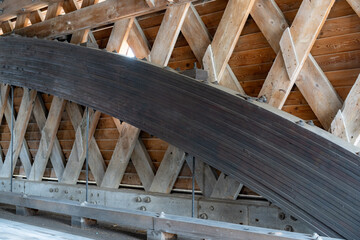 Interior image of historic timber one lane covered bridge in the Town of Newfield, Tompkins County NY.	