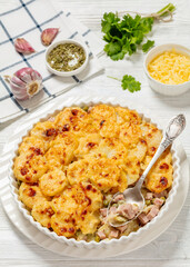 au gratin potatoes with diced ham and green peas