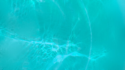 Blue wave abstracts or natural rippled water texture background Water waves in sunlight. Blurred transparent blue colored clear calm water surface texture with splashes and bubbles.  - obrazy, fototapety, plakaty