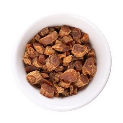 Dried cut red Korean ginseng root in a white bowl. Panax ginseng, also known as Asian or Chinese ginseng. Used as an herb in folk medicine, consumed by adults to improve memory, cognition and others.