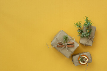 Zero waste Christmas concept. Natural gift materials paper fir branches dried citrus cinnamon on a...