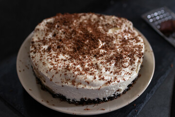 Classic banoffee pie a simple cookie crust is filled with thick caramel, slices of fresh banana and whipped cream on top. 