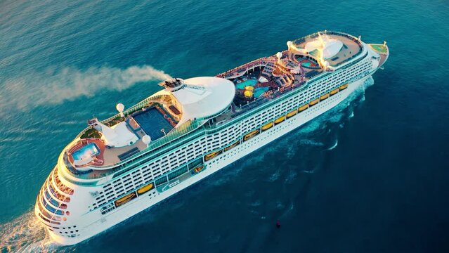 Cruise ship sailing across The Mediterranean sea - Aerial footage. luxury cruise in the ocean sea concept tourism travel on holiday take a vacation time on summer. 