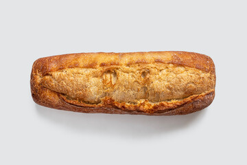 Baguette with a crispy golden crust on a light background