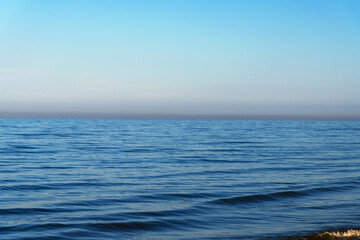 Fototapeta na wymiar Blue and still Baltic sea.