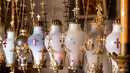 Stone of Anointing lamps in Holy Sepulchre Church in Jerusalem