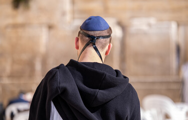 Undefined orthodox jewish man pray at the Western Wall. Jerusalem