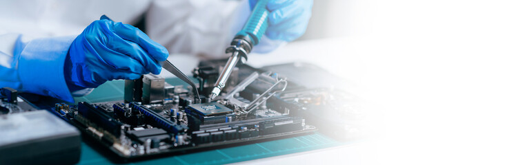 The technician is putting the CPU on the socket of the computer motherboard. electronic engineering electronic repair, electronics measuring and testing, repair.. - obrazy, fototapety, plakaty