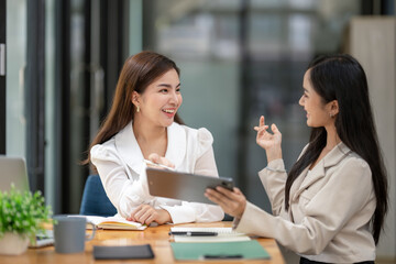 Two business worker consult and plan together. Brainstorm, share, and discuss business project ideas.