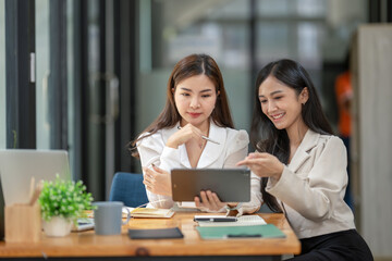 Obraz premium Two business worker consult and plan together. Brainstorm, share, and discuss business project ideas.