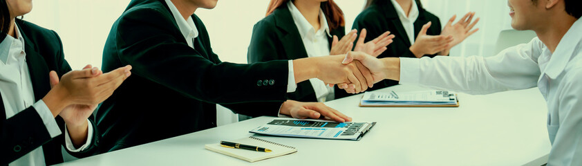 Business people group handshake at meeting table. Job interview success or making successful...