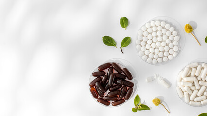 Various vitamins and dietary supplements in small medical plates. Medicine, medicines. Copy space