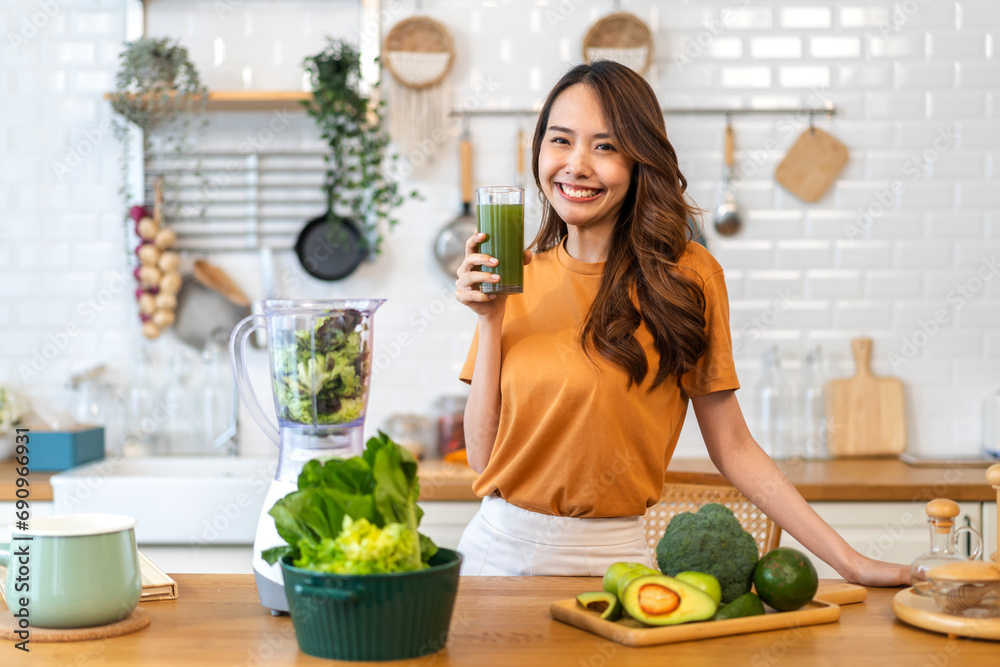 Wall mural portrait of beauty healthy asian woman making green vegetables detox cleanse and green fruit smoothi