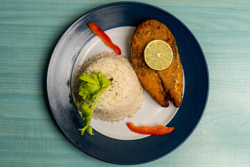Fried salmon filet with white rice