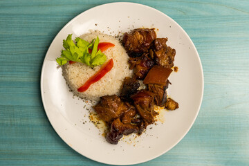 Dominican braised ribs with white rice