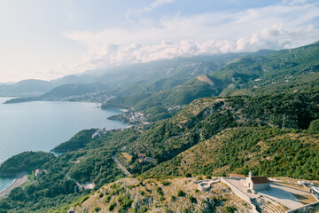 Fototapeta na wymiar Drone view of the Church of St. Sava above the island of Sveti Stefan. Montenegro