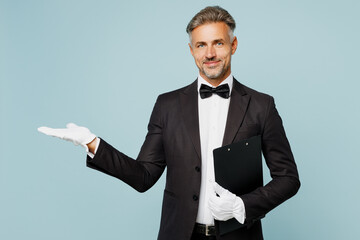 Adult fun barista male waiter butler man wear shirt black suit bow tie elegant uniform hold...