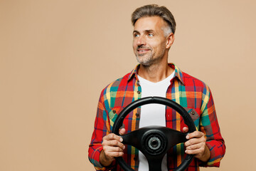 Adult smiling man he wears red shirt white t-shirt casual clothes hold steering wheel driving car...
