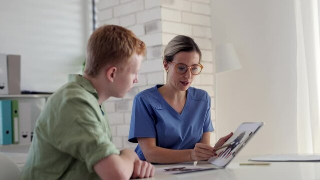 Teenager taking Rorschach test during psychological therapy with adolescent psychologist. Psychological session for teenage boy. Concept of teen mental health and unique adolescent behaviour, problems