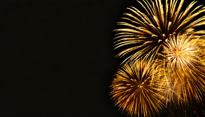 Gold fireworks explosion with copy space on black background. - obrazy, fototapety, plakaty